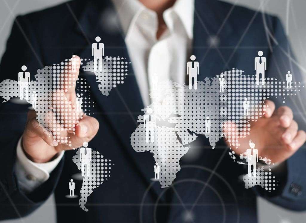 EOR vs PEO businessman touching a digital screen overlay depicting global HR management.