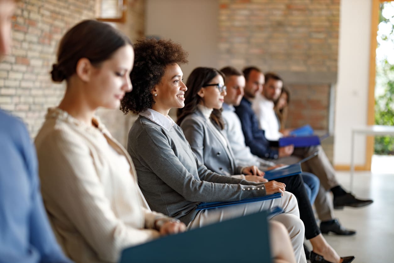 Recruiting for global expansion - A group of diverse professionals waiting for their job interview.