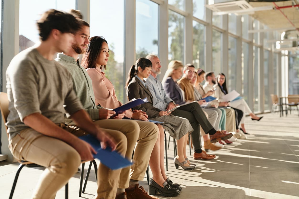 EOR risk mitigation for businesses - A group of diverse employees waiting for their turn during an interview.