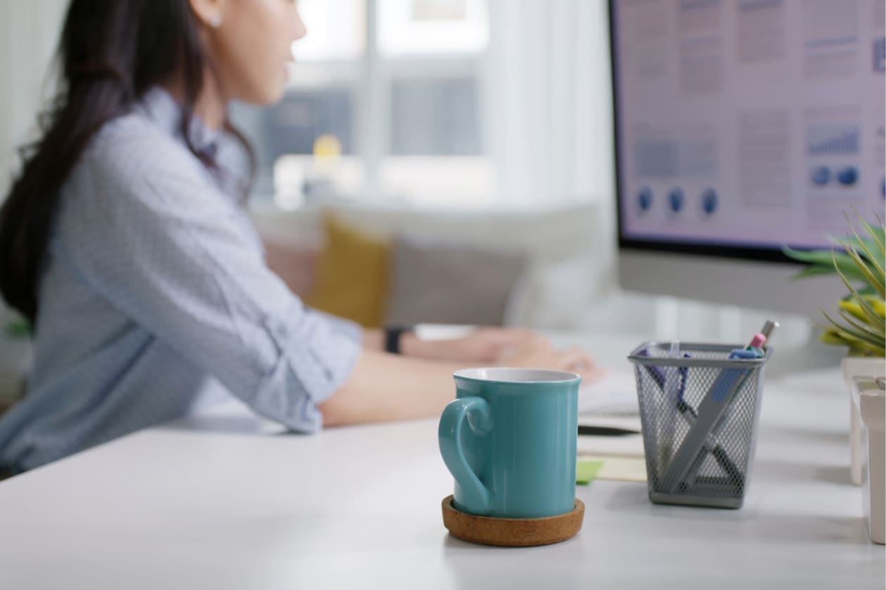 Work-from-home productivity - A woman working at home and using her computer to do her tasks.