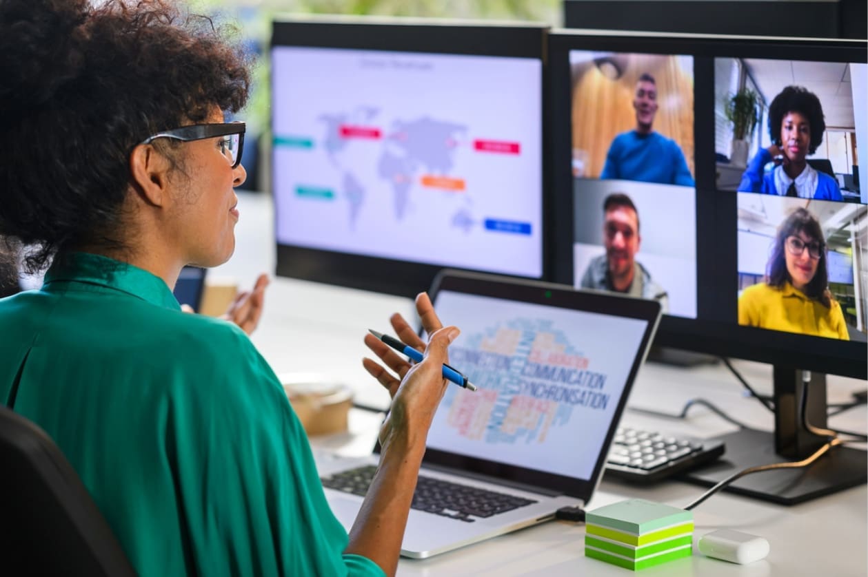 Employee retention strategies - A female manager having a meeting with her remote employees from different time zones.