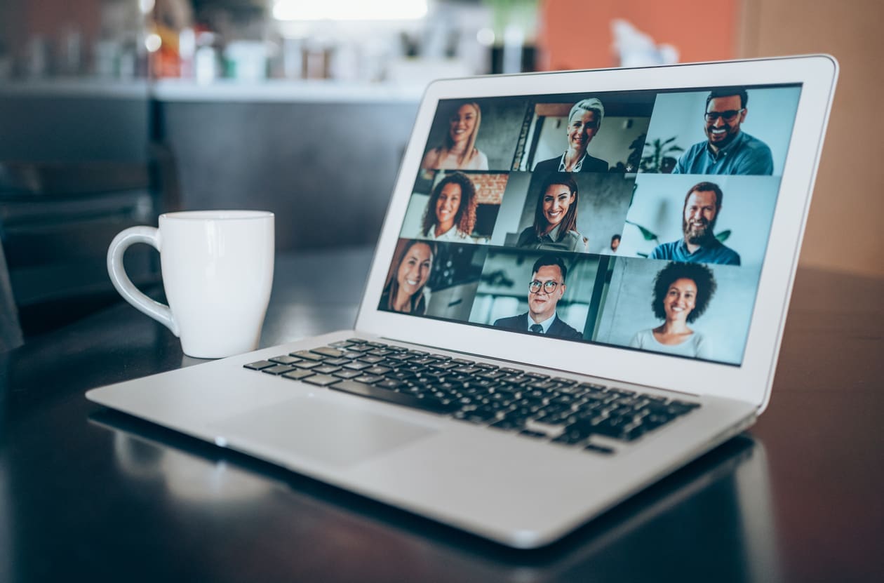 Company culture for remote workers - A laptop showing a video conference call between employees.