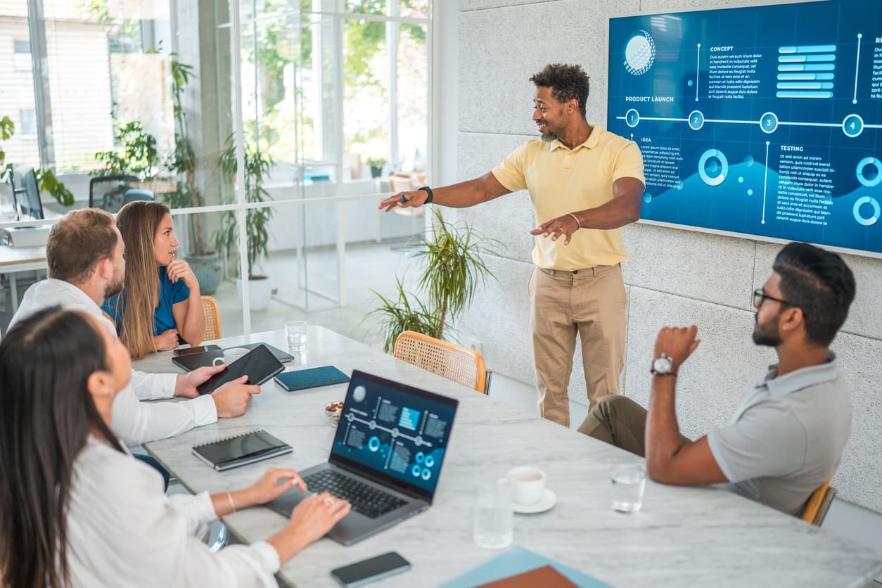 Scaling operations - A businessman conducting a meeting with his business partners.