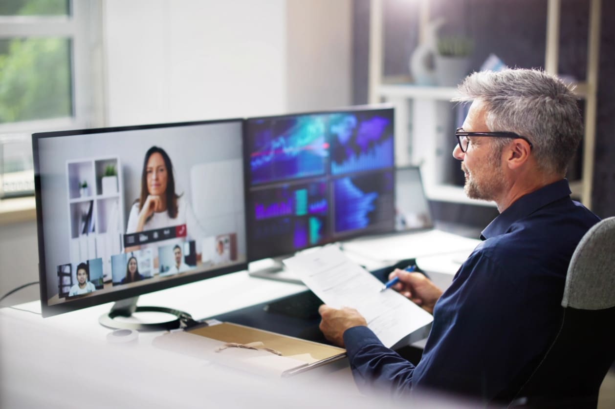 Hiring in Canada - A businessman having a virtual meeting with his Canadian business partner.